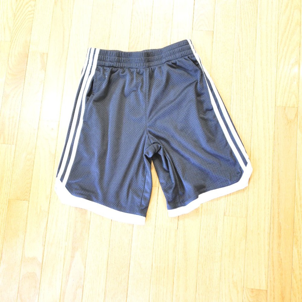 Boys black short with white side stripes, size M (10/12)